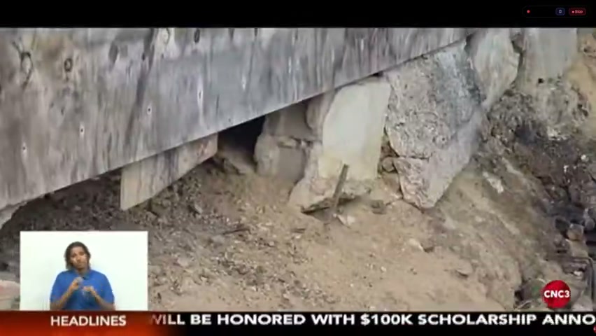 Crumbling, eroding ground behind the family's roadside stall home in Princes Town