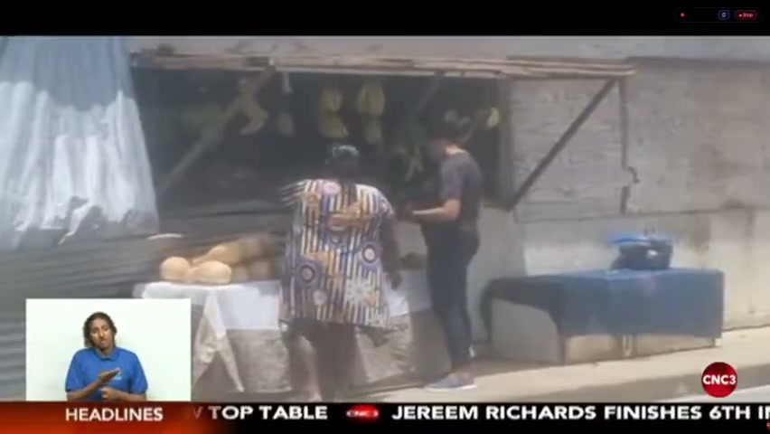 Sabrina Khadoo serving a customer at her roadside vegetable stall on the Naparima-Mayaro Road, Princes Town